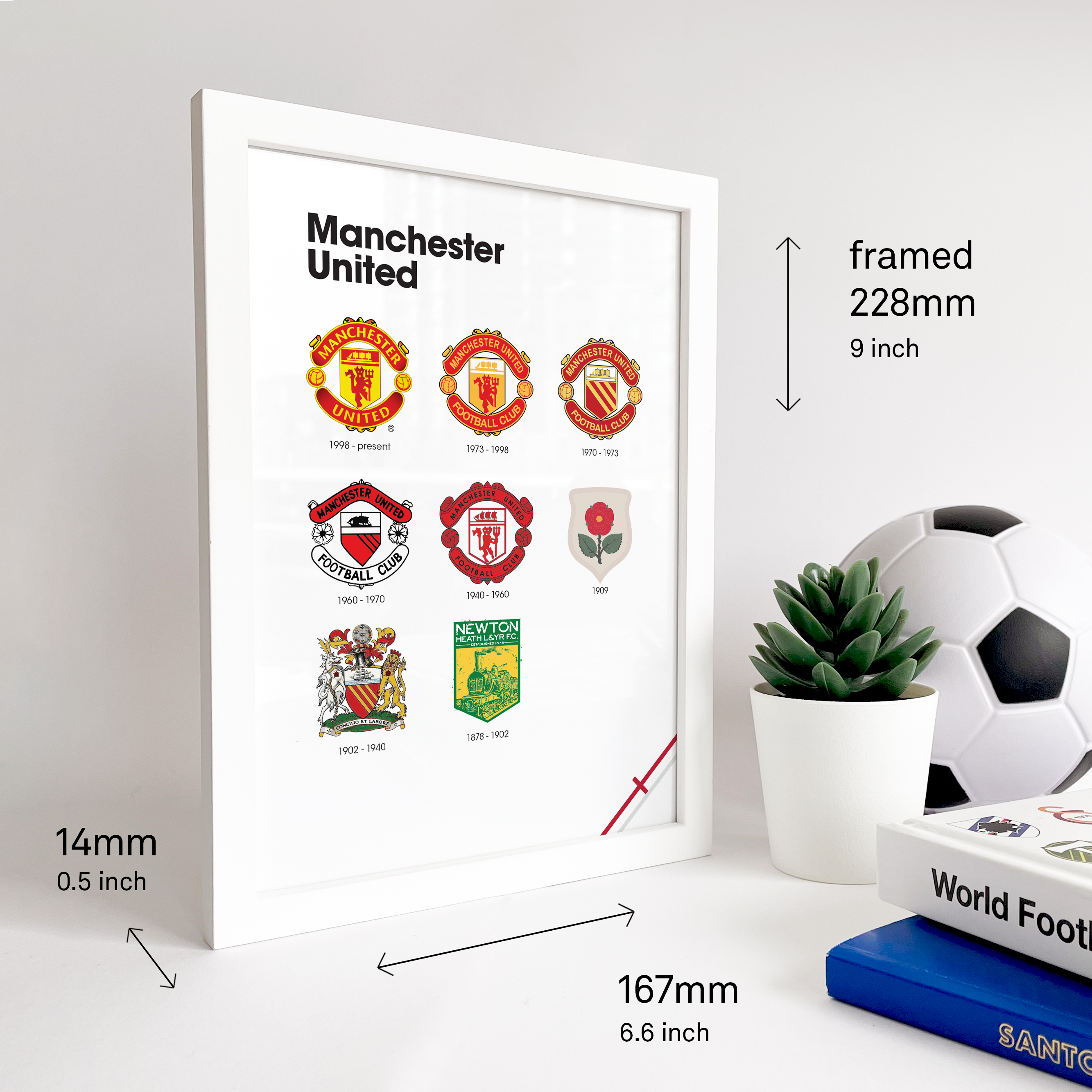 Manchester United Logo History print image that shows the size of the frame which is a bit bigger than A5. Next to the frame two football books and a ball is visible.